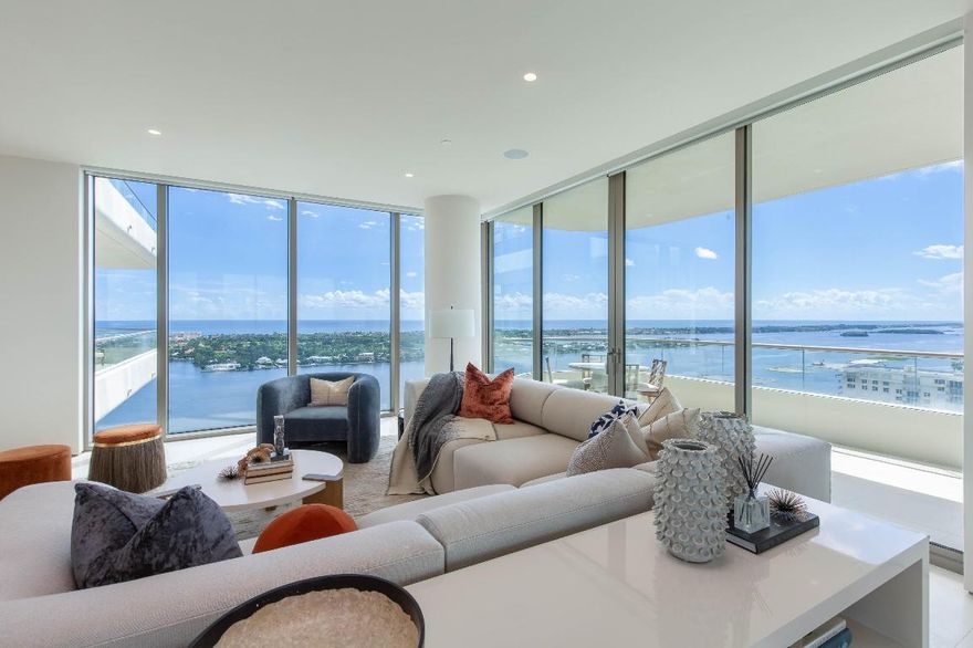 Drastic Price Improvement! Welcome to La Clara, a pinnacle of luxurious living in the heart of West Palm Beach. This exceptional 3-bedroom, 3.5-bathroom condominium is more than just a home; it's a statement of unparalleled sophistication and comfort.

As you step into this fully furnished residence, you'll be immediately struck by the exquisite interior design crafted by the renowned Marc Michaels Interior Design team. Every detail has been carefully considered to create an ambiance of timeless elegance. 

Spanning an impressive 3,158 square feet, this brand new construction offers the epitome of modern living. Floor-to-ceiling windows grace each room, bathing the space in natural light and framing breathtaking views of Palm Beach, the Intracoastal Waterway, and the downtown West Palm Beach skyline. The open-concept living area connects to a wrap-around terrace, where you can savor both sunrise and sunset views. The gourmet kitchen is a chef's dream, featuring top-of-the-line Miele appliances that blend seamlessly with the sleek design. Motorized shades throughout the condo offer privacy and convenience at the touch of a button.

La Clara redefines luxury living with its 5-star services and amenities. Residents are pampered with 24/7 valet and front desk services, an onsite concierge to attend to your every need, state-of-the-art fitness and wellness facilities, and spa complete with sauna, steam, and massage room.