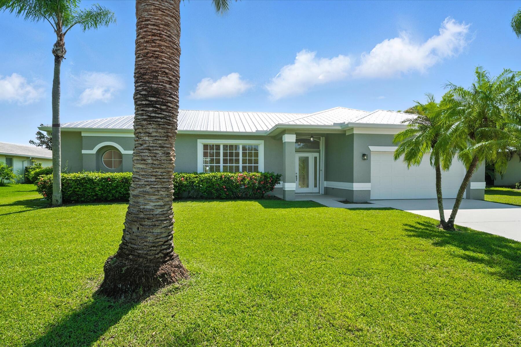 Welcome to your dream home, perfectly situated on a half-acre lot! This beautifully renovated 3-bedroom, 2-bathroom plus den residence offers the perfect blend of style, comfort and location. Every detail inside has been thoughtfully updated with modern finishes, creating a move-in ready oasis that feels brand new.Step inside to an open and airy floor plan featuring a formal living room, dining room, family room and versatile den that can easily serve as a home office. The gourmet kitchen shines with sleek cabinetry, quartz countertops, and stainless-steel appliances.Relax and unwind in the spacious primary suite, complete with a spa-inspired bathroom and generous closet space. Enjoy the Florida lifestyle with a sparkling private pool and expansive patio overlooking a lush golf course--