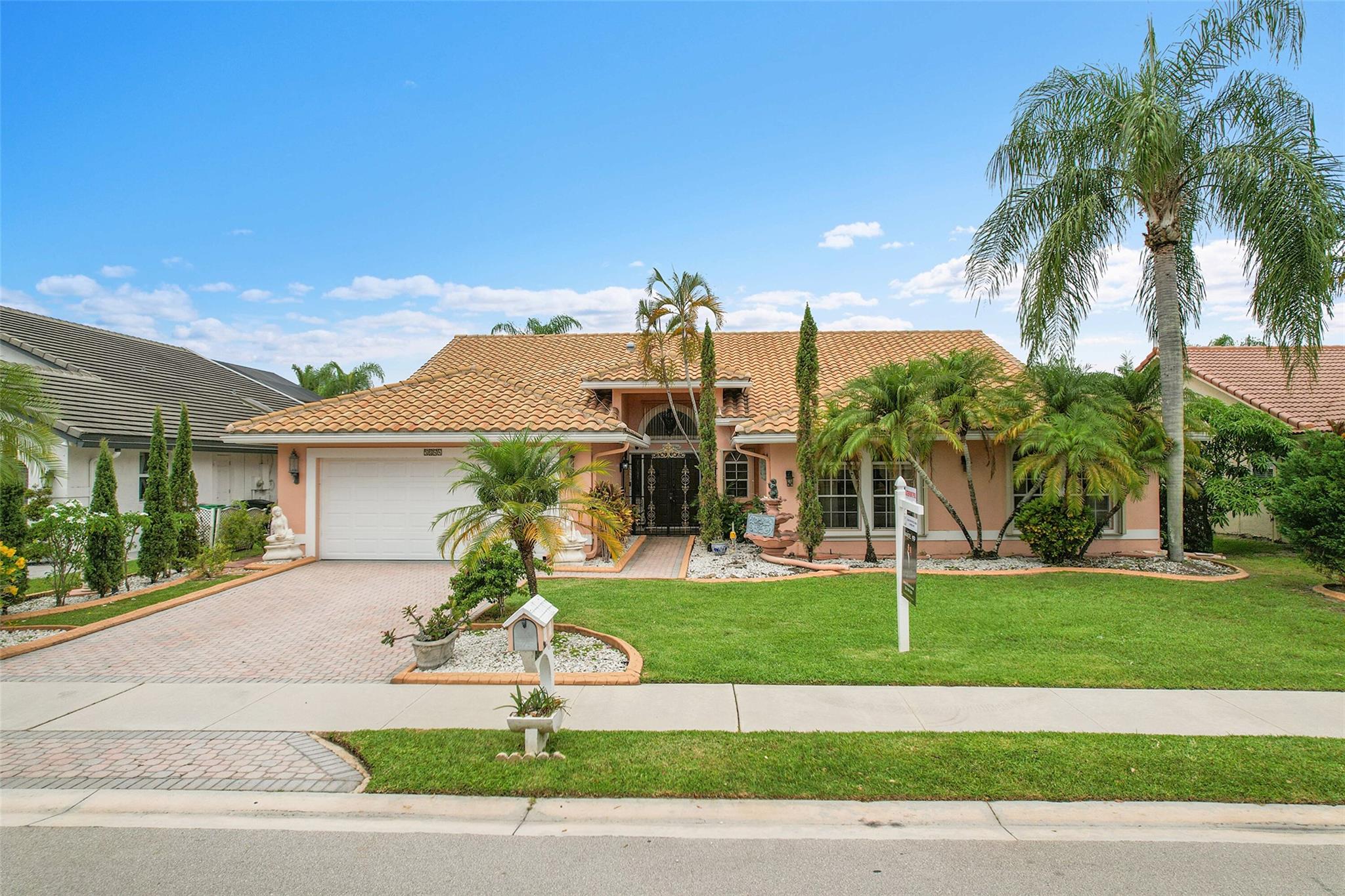 Imagine the sunsets here! Panoramic lake & pool views the moment you walk into this beautifully maintained home in the sought-after North Springs neighborhood - no HOA! Vaulted ceilings & tons of natural light make the space feel even bigger. Bright, open layout offers great flow for everyday living & entertaining. Spacious family room connects seamlessly to the kitchen & breakfast area - perfect for gatherings. Large primary suite has a sitting area w/ lake views & two walk-in closets w/ built-ins. The primary bath features double vanities, soaking tub, & a separate shower. All bedrooms are generously sized. 1/2 bath for guests & separate pool bathroom outside, so no one has to bring water through the house after swimming. This smart & functional layout works for any lifestyle.