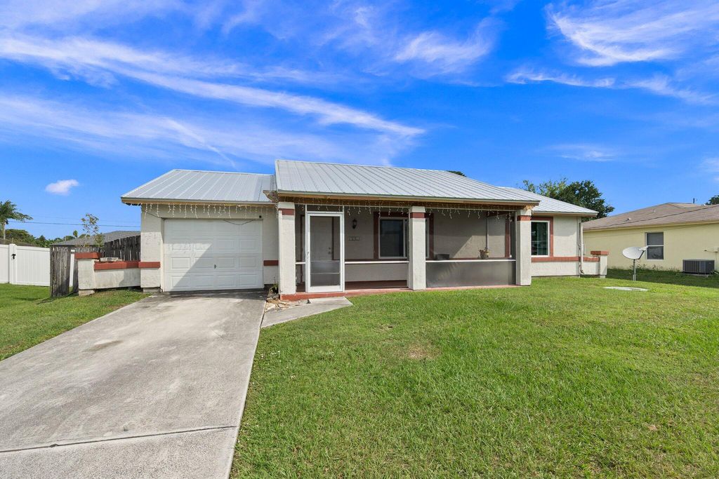 Photo of 731 NW Bayard Avenue, Port Saint Lucie, FL 34983 (MLS # R10970861)