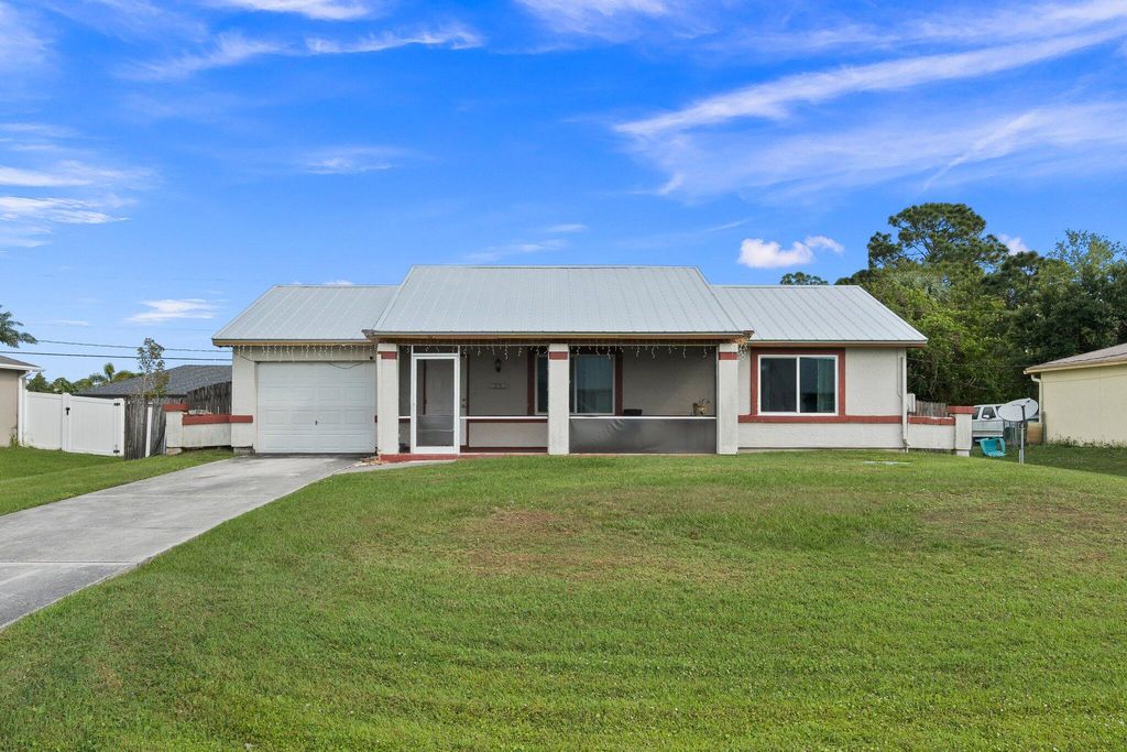 Photo of 731 NW Bayard Avenue, Port Saint Lucie, FL 34983 (MLS # R10970861)