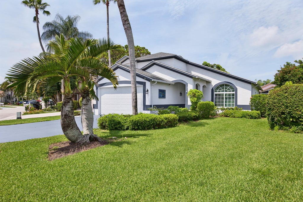 Photo of 126 HAMMOCKS Drive, Greenacres, FL 33413 (MLS # B26058005)