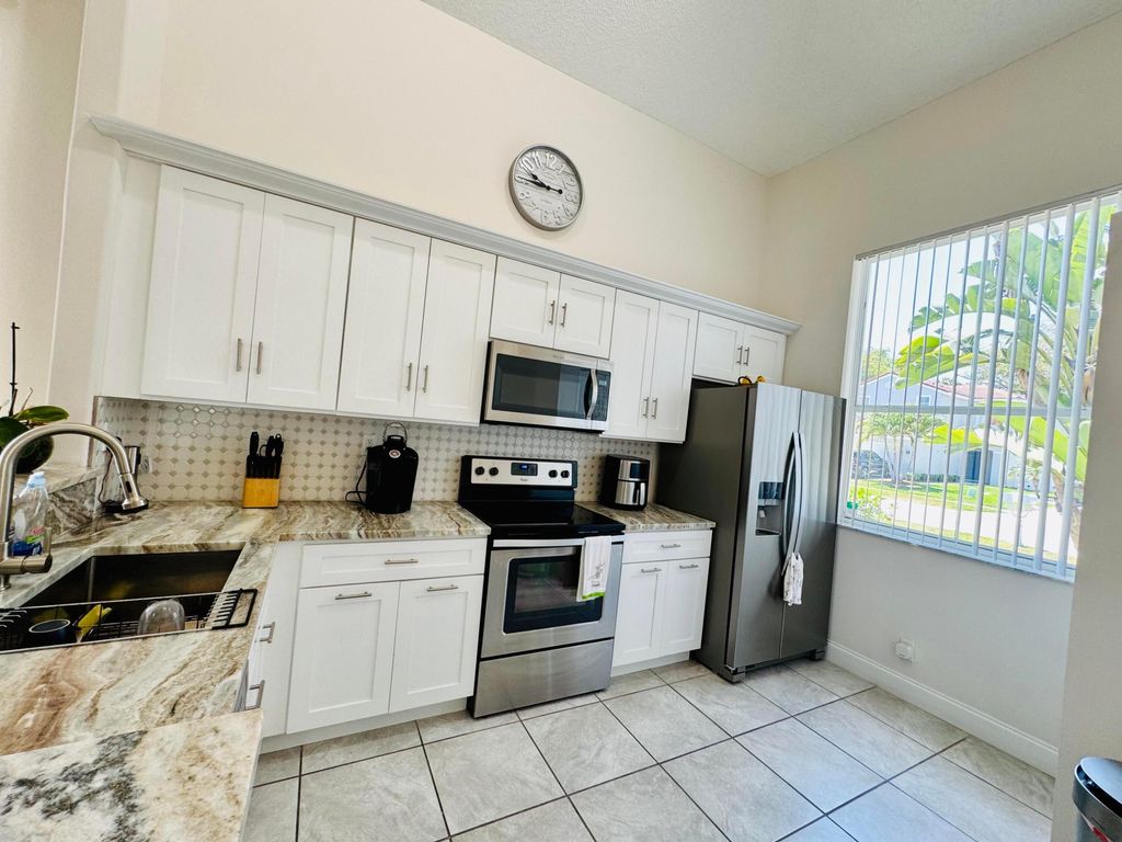 Photo of 6752 SE Green Island Circle, Lake Worth, FL 33463 (MLS # R11097640)