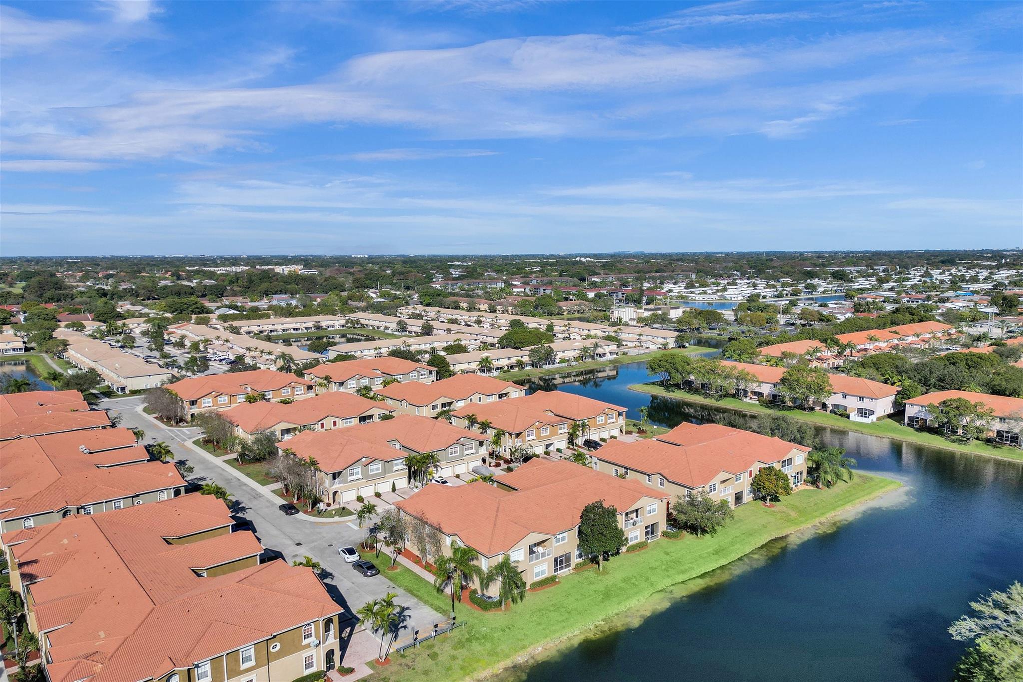 LARGER 3br, 2.5bth, 1777sf, TWO STORY Townhome W/one car garage close to the Turnpike & Sawgrass Expressway for an easy commute & walking distance to Elem & Middle Schools. PRIVATE WATERFRONT location with NO neighbors behind. Tucked away from busy roads ensuring minimal traffic & a quiet environment. Modern farmhouse vibe featuring an updated kitchen w/plenty of counter space, a large master suite w/walk in closet & laundry upstairs for convenience. Enjoy peaceful water views from your enclosed patio, LR/DR & master suite. Investors, PROPERTY CAN BE RENTED AFTER PURCHASE. *Reasonable $577 fee considering water, cable, internet, alarm, amenities, roof, gated security, common area are included. *This one stands out for SIZE 1777 sf, TWO STORY LAYOUT, LOCATION & PRIVACY* Come see it!