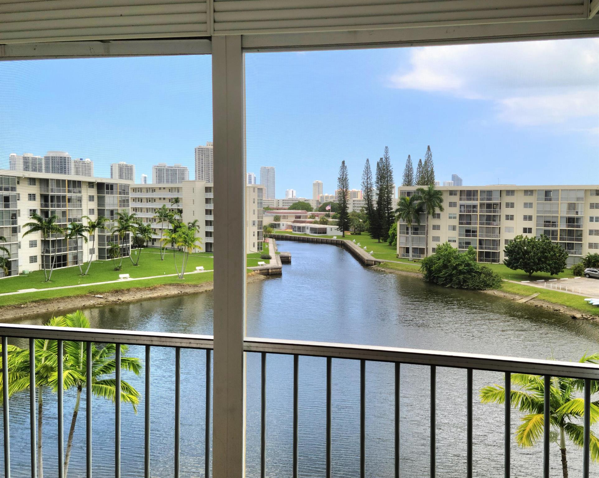 55+ Community. Sold ASIS for seller's convenience. Beautiful views of lagoon and intracoastal waterway. Recently installed wood-look luxury vinyl flooring, A/C 2 yrs., HW heater 4 yrs, roll-down shutters surround large corner balcony and freshly painted. Great location for active senior living in Aventura: 24-hour security, breath-taking views, 4 pools, gym, bowling alley, billiard room, bocce court and saunas. Lots of activities for residents: exercise classes, bingo, dominoes, dancing and live shows in the spacious auditorium. Walk to many shops and restaurants or short drive to beautiful beaches, Aventura Mall, Bal Harbour Shops or ride Aventura Express Shuttle.