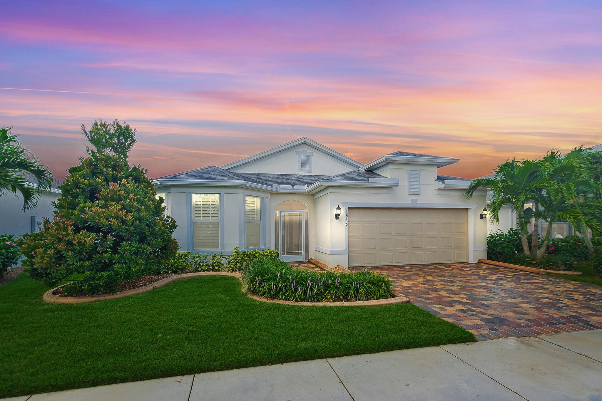 DelWebb! Indulge in luxury with this exquisite lakefront 2/2/2 +flexroom home, boasting over $150K in premium upgrades. This expanded Summerwood open floorplan has diagonal tile floors, crown molding, 8' designer doors, plantation shutters, french doors that seamlessly blends indoor comfort with outdoor charm. Gourmet kitchen has quartz counters, 42'' wood cabinets, gas cooking, tiled backsplash, walk in pantry. Step outside to your personal oasis : a covered, screened paver lanai with electric sunshades, and an additional open paver patio with a retractable shade--perfect for enjoying Florida's beauty year-round. The fenced yard with doggie door is perfect. High Impact Glass, whole house generator, tankless gas water heater. Enjoy world-class amenities 55+ active gated community.