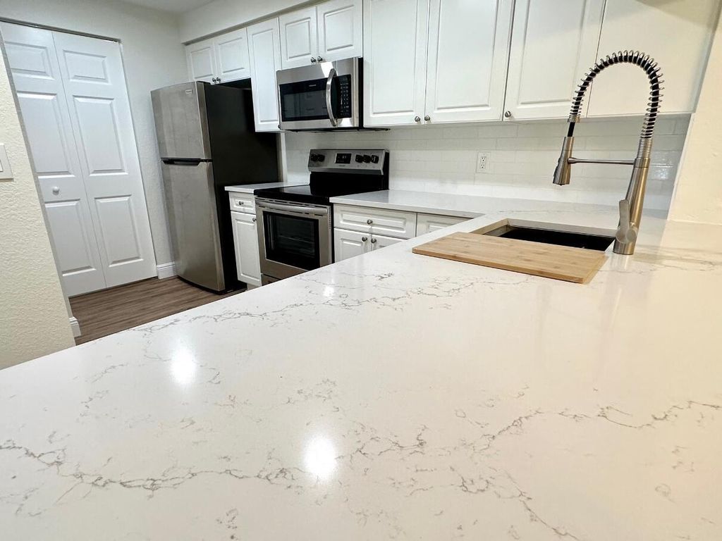 Photo of 3018 Alcazar Place #106, Palm Beach Gardens, FL 33410 (MLS # R11081008)