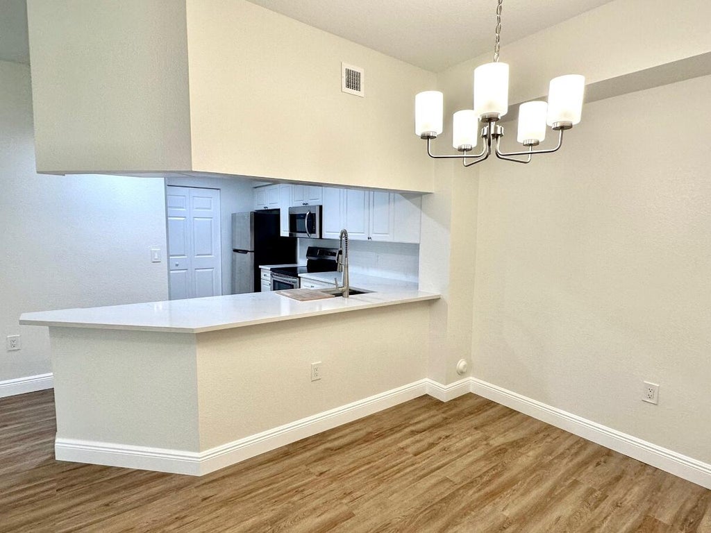 Photo of 3018 Alcazar Place #106, Palm Beach Gardens, FL 33410 (MLS # R11081008)