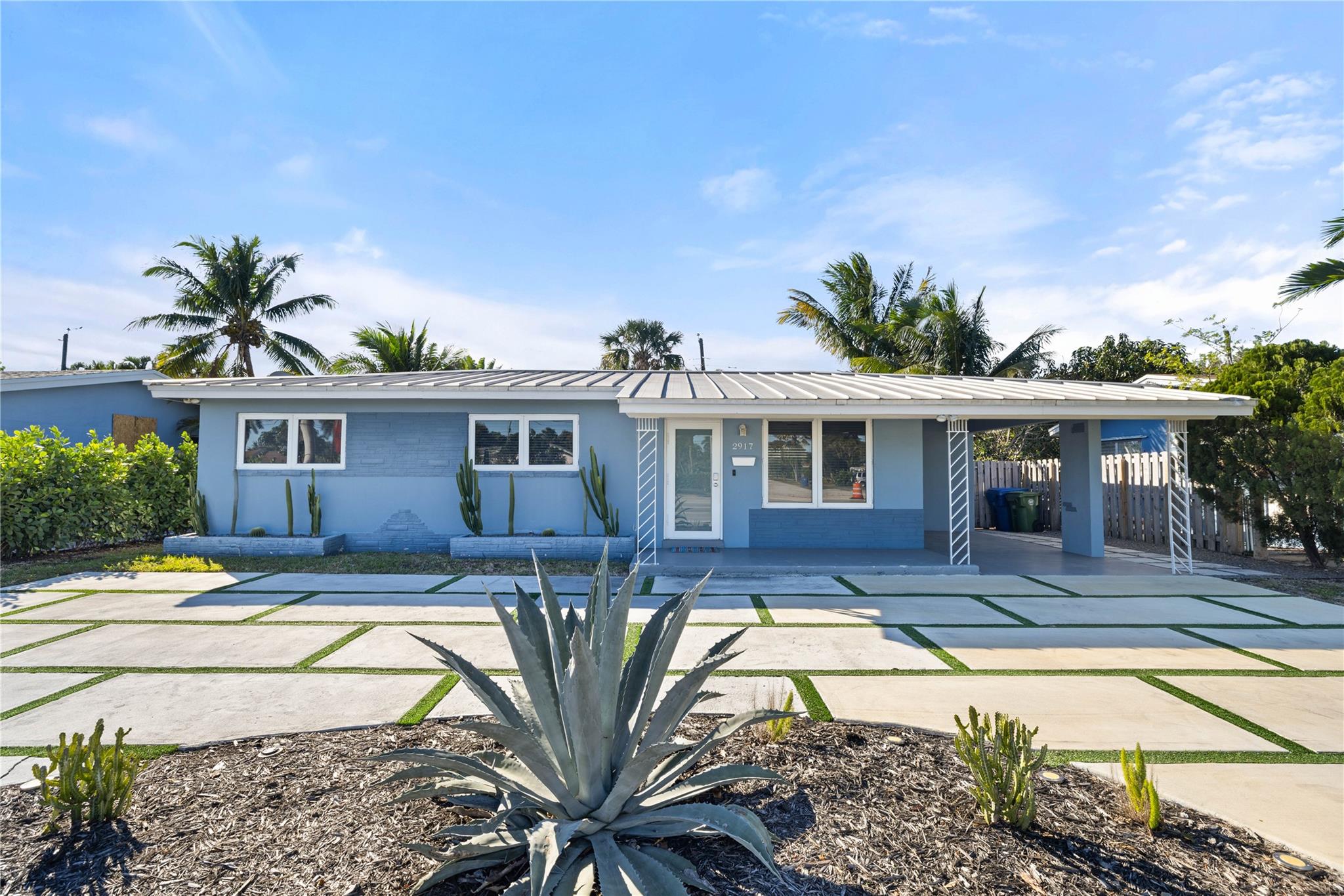 PRICED TO SELL! Designed for effortless Florida living, this turnkey residence offers the perfect balance of style, durability, and location—just minutes from Wilton Drive, I-95, the beach, and more. Upgraded to meet today’s standards, the home features a metal roof, full-impact windows and doors for potential insurance savings, PVC plumbing to the street, and a newer AC. Inside, enjoy a fully renovated interior with modern finishes, newer appliances, spacious bedrooms, smart home features, and a sunroom. The outdoor space includes a sunlit yard, private putting green, and deck for al fresco dining, all within a fully fenced, low-maintenance lot with mature landscaping. A refreshed driveway and carport complete the package. Ideal for both homeowners and investors. Tour today!