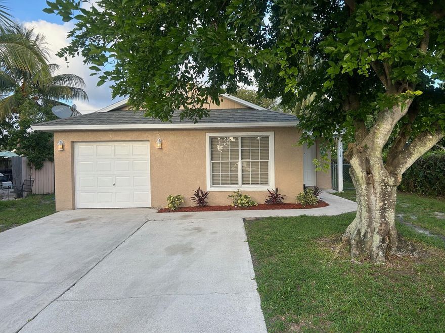 Great open layout home in the heart of Boynton Beach. Tile and wood floors, freshly painted, private fenced yard, and pets welcome. The garage has been converted into a room.