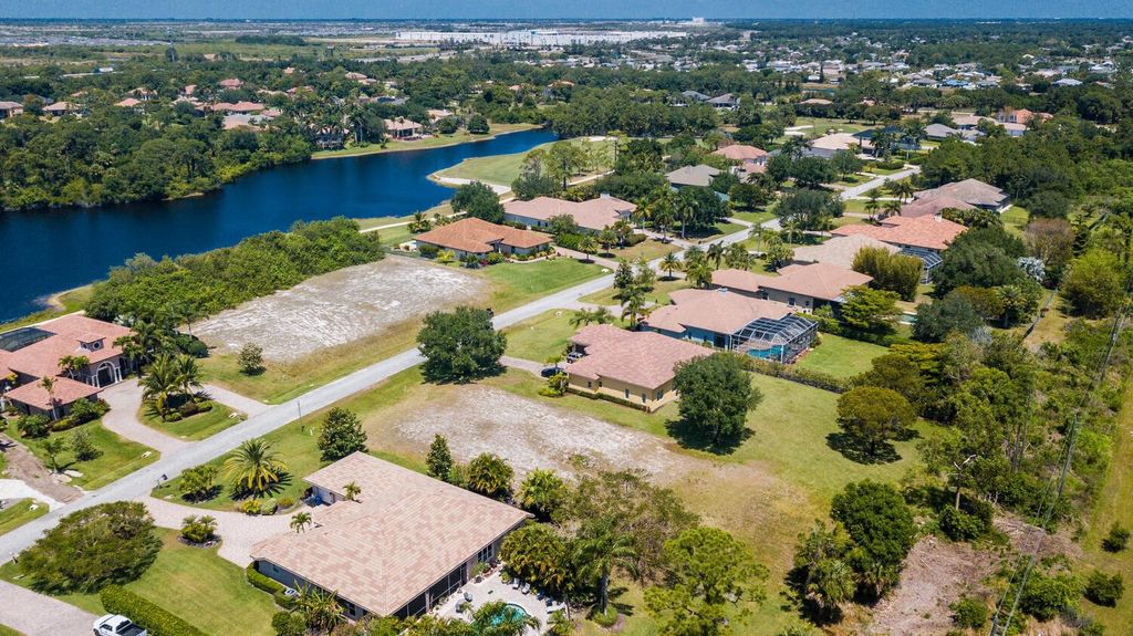 Photo of 1015 SW Squire Johns Lane, Palm City, FL 34990 (MLS # R10979284)