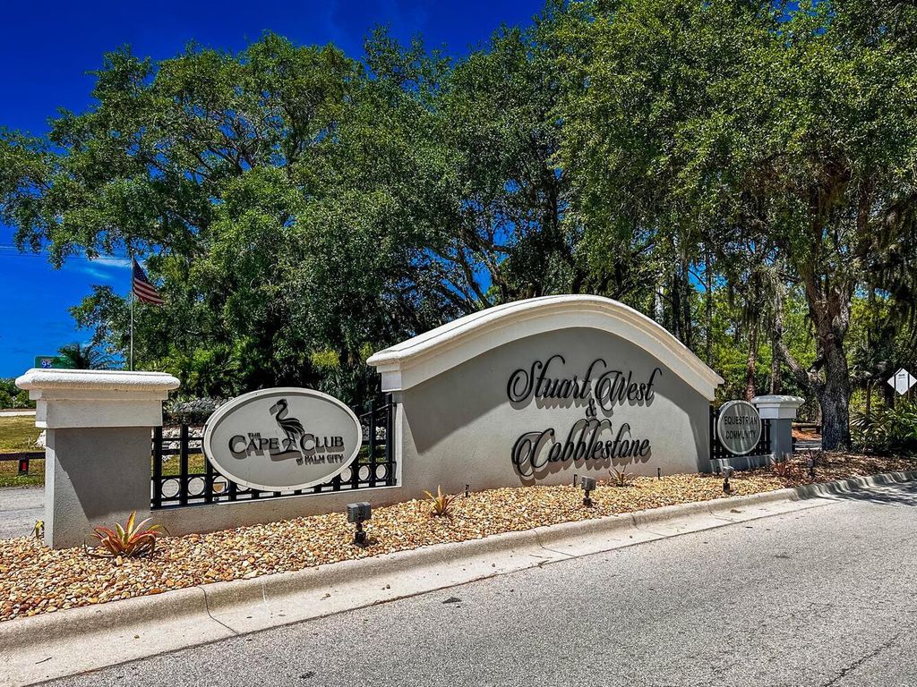 Photo of 1015 SW Squire Johns Lane, Palm City, FL 34990 (MLS # R10979284)