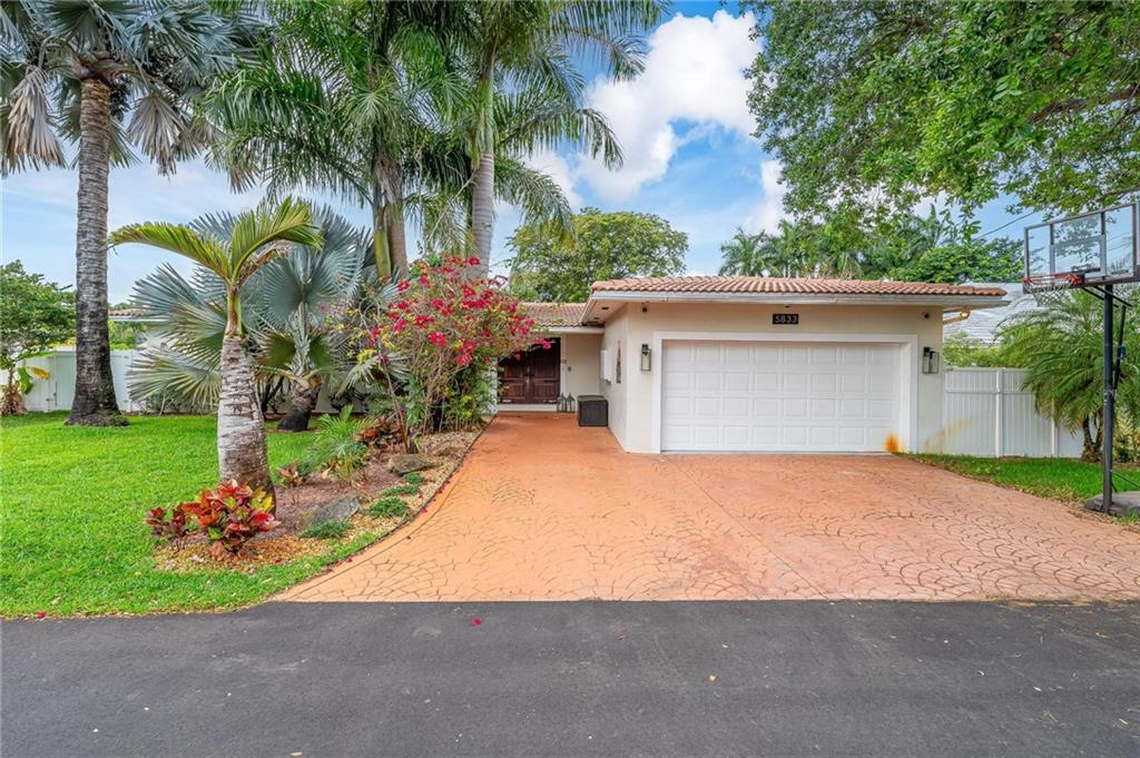 This tropical oasis awaits its new loving family. Nestled on a dead end street which is a community in and of itself, this 5 bedroom, 3 bath home is the ideal location for you. Country living, in the heart of the action! A lush backyard with a newly finished, oversized pool and spectacular rock grotto will greet you, while sitting under the amazing pergola sipping your favorite beverage. Bring the outdoors inside, to a marvelous master suite with amazing natural light and extra high ceilings. You will have plenty of room for family, friends and guests in the well-appointed bedrooms and living spaces. The kitchen is currently being remodeled and will be delivered complete along with the new buyer being able to pick finishes (if acted on quickly). Near houses of worship.