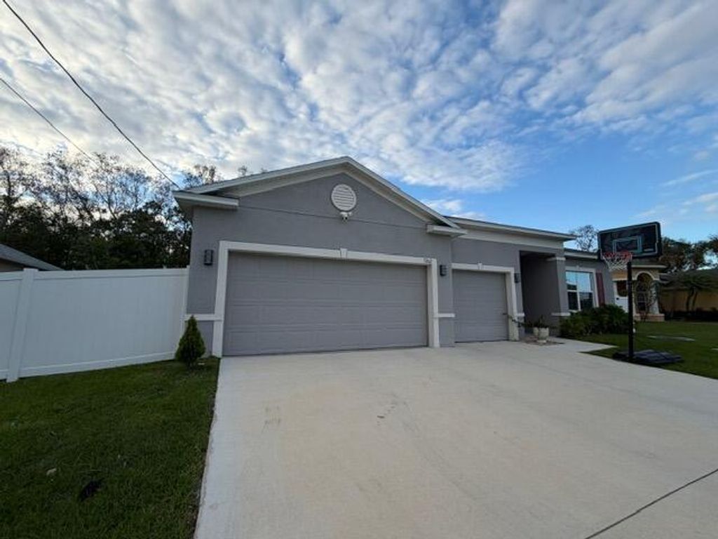 Photo of 5262 NW Rugby Drive, Port Saint Lucie, FL 34983 (MLS # B26018017)