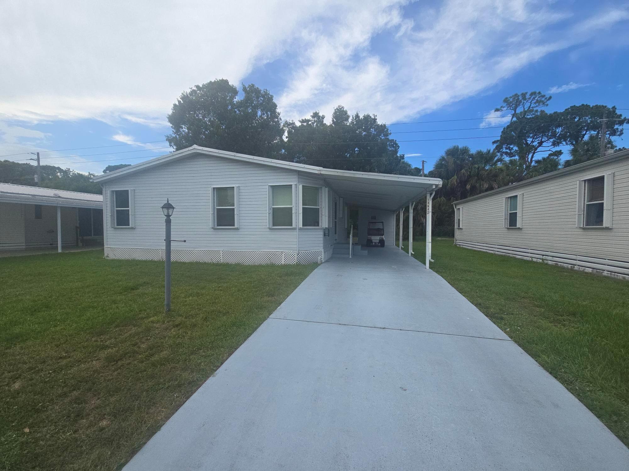 Private 2 Bed, 2 Bath Retreat on Perimeter Lot - Updated & Move-In Ready!Discover peace and privacy in this charming 2 bedroom, 2 bath home perfectly situated on a desirable perimeter lot--no rear neighbors, just serene woods and lush vegetation to enjoy from your spacious rear Florida room. This home has been thoughtfully updated for comfort and reliability, featuring: Newer Metal Roof (2020), Newer AC (2024), Newer Water Heater (2023)Additional highlights include:Large covered carportInterior laundry area for convenienceDurable laminate flooring throughoutSpacious layout ideal for year-round or seasonal living, Don't miss out on this hidden gem in a peaceful setting. Schedule your private showing today!