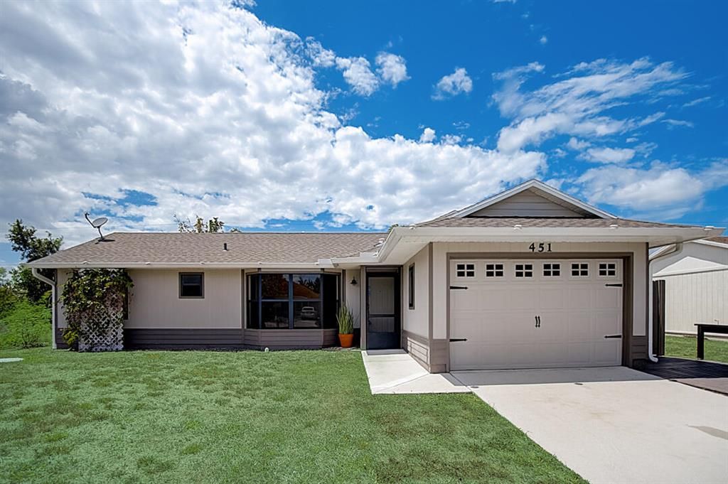 Photo of 451 SW Baoy Avenue, Port Saint Lucie, FL 34953 (MLS # R10800942)