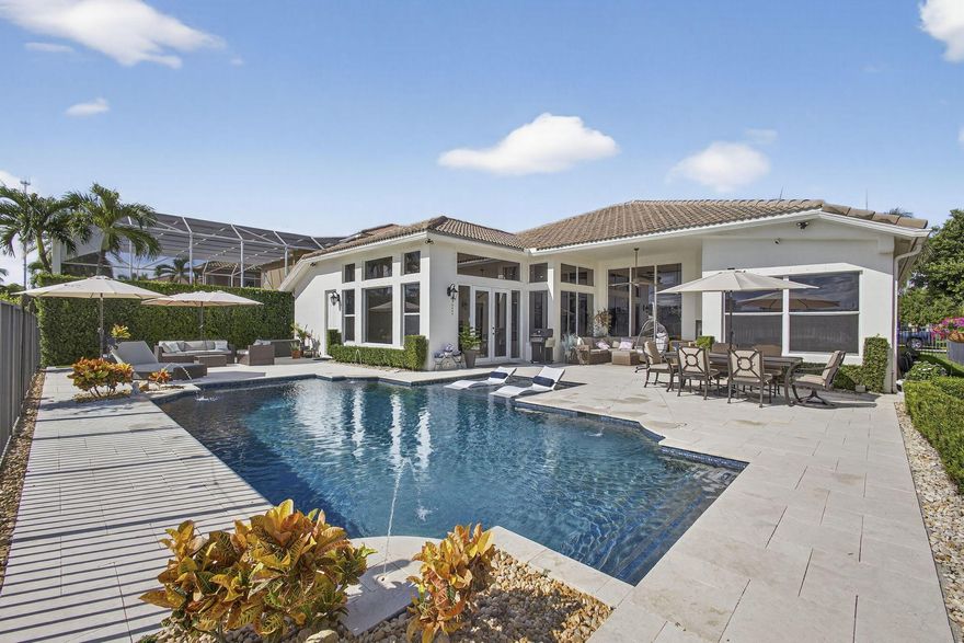 Your dream home is here!  Just minutes from Wellington's equestrian venues, upscale shopping, fine dining, top schools, and premier medical facilities, this stunning 4-bedroom, 3-bath home with a private office and 3-car garage offers unmatched luxury. Walls of glass showcase lake and pool views, while the kitchen and custom bioethanol fireplace provide elegance and comfort. The primary suite is a serene retreat with water views, and the resort-style pool with sun shelf and deck jets makes outdoor entertaining effortless. Open living spaces, abundant natural light, and expansive outdoor areas define South Florida living--perfect for those seeking style, privacy, and convenience. Schedule a tour today!