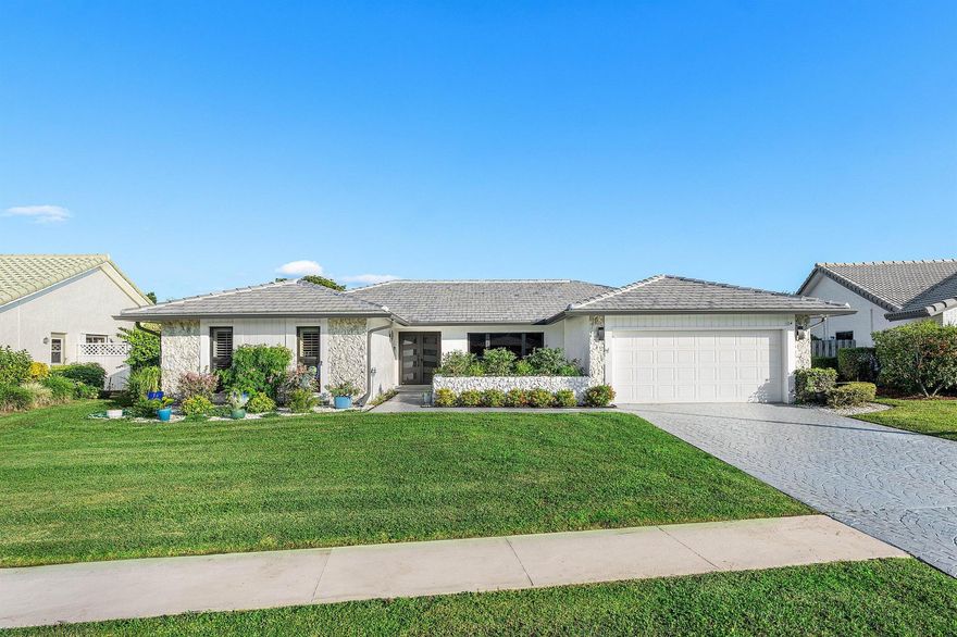 Stunning renovated ranch home with a modern open floor plan and a spacious, versatile layout! This light-filled residence offers 3 bedrooms plus a bonus room--perfect as a dining room, playroom, office, or flex space to suit your lifestyle. Enjoy peace of mind with all impact windows and a brand-new roof, along with beautiful wood floors throughout that add warmth and elegance to every room. Step outside to your personal paradise: a beautiful pool with a tranquil lake view, a large covered patio, all set on a private lot. The community offers pay-as-you-play golf with no membership required, plus a private outside tennis program  within the community with the option to join. Thoughtfully updated with long-lasting enhancements, this home offers peace of mind and a truly elevated lifestyle.