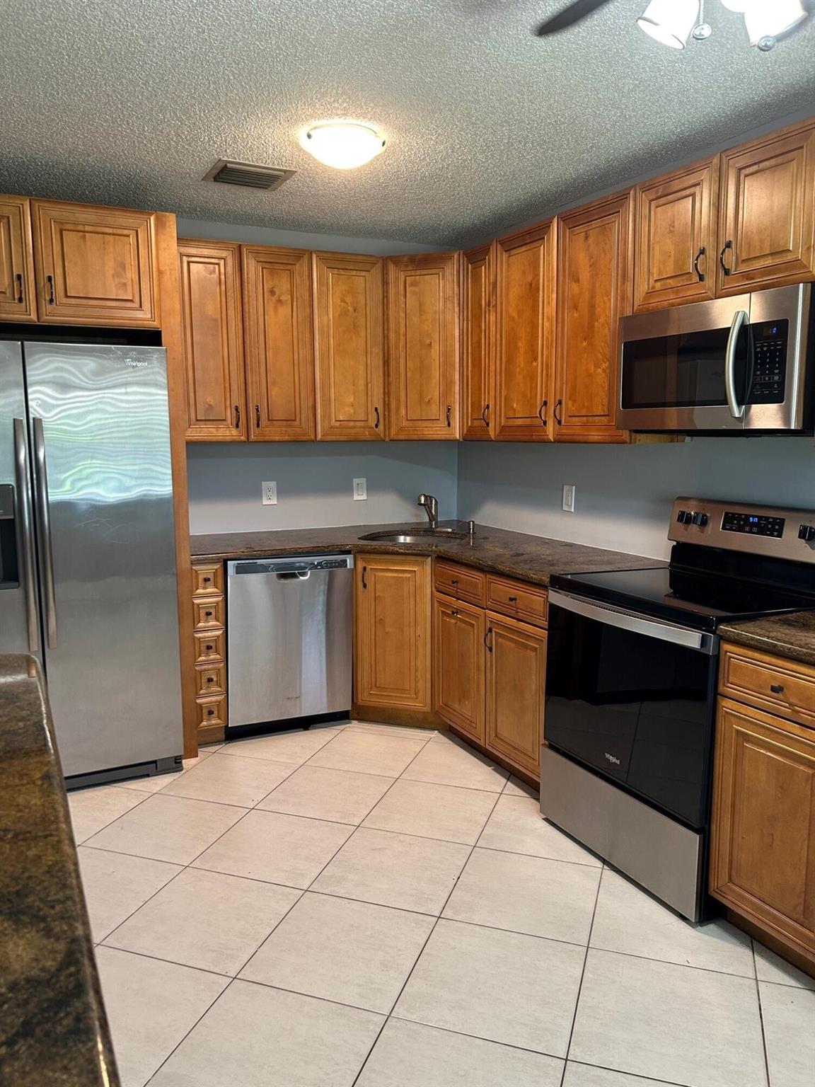 Beautiful three-bedroom two-bathroom carpet free villa in excellent location. freshly painted, brand new floors, granite counter tops,Vaulted ceilings, large bath and closets, huge laundry room, Large Fenced patio. Nicely upgraded kitchen with granite countertops. 2 assigned parking spots. Community pool.credit score must be 670 or better for everyone over 18. Verifiable income $7000 or greater. Security deposit 2 months, no last month