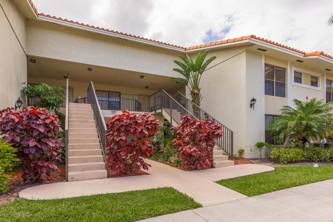 Enjoy beautiful sunset views from this bright & spacious, updated 2BR/2BA condo surrounded by a peaceful parklike setting in the Palm Beach Place community of West Palm Beach. There are many desirable features and upgrades throughout, such as large tile flooring, fully updated kitchen with newer spacious cabinets with crown molding, stainless steel appliances, and granite countertops, and a spacious master suite with a large window, lighted ceiling fan, and ample storage space. All bathrooms have granite countertops. The covered back patio has enough room for grilling and has views of the green yard, waterfront, and mature trees.