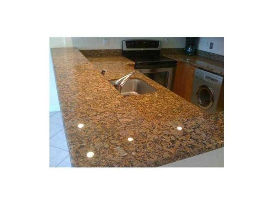 This one has it all -- location, granite kitchen, laundry in unit, close to Holiday Park and Las Olas, blocks from Publix and in quiet, but super hot Victoria Park! There is one assigned parking space right by the door and plenty of guest parking. The complex has a health club quality gym and resort style pool. There is a convenience store on site.