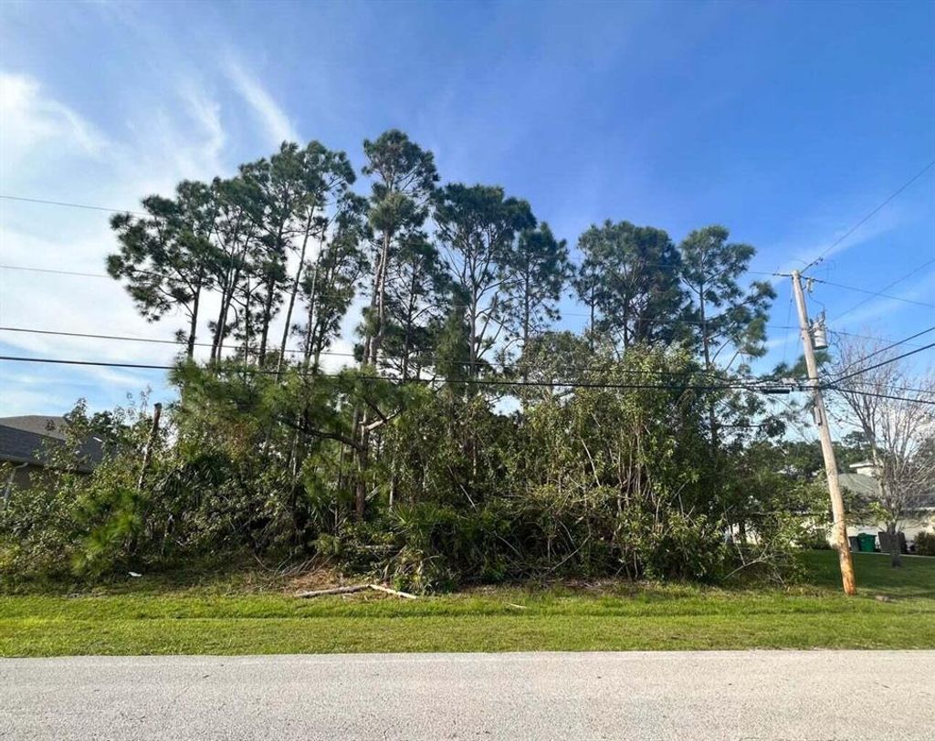 Photo of 5833 NW Wesley Road, Port Saint Lucie, FL 34986 (MLS # R10876407)