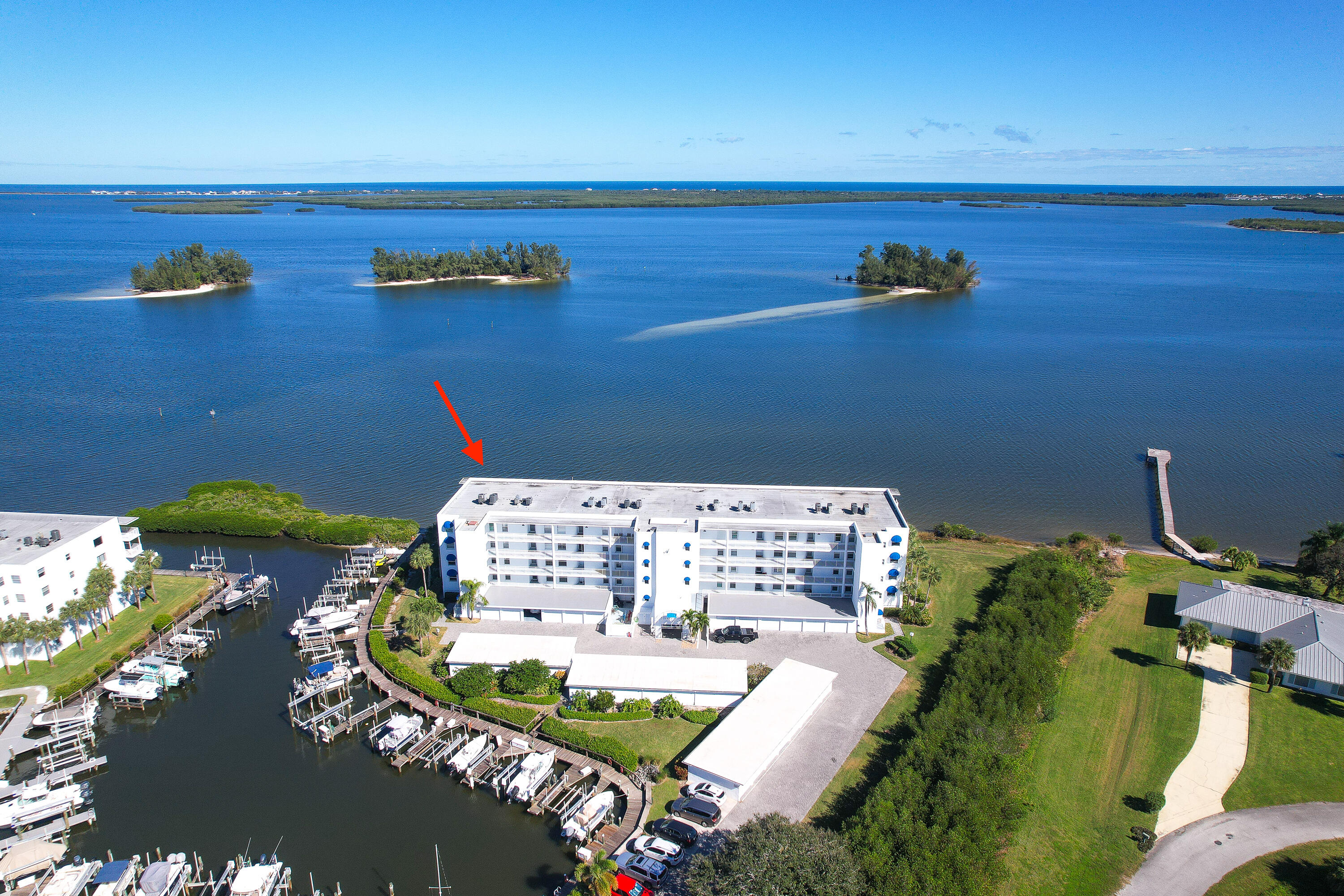 Discover your dream waterfront lifestyle in this luxurious condo nestled within the highly sought-after building 'A' of the gated River Run community. This stunning property offers breathtaking views of the Indian River Lagoon, Marina, and River, captivating you with panoramic vistas from your private balcony.Immerse yourself in the beauty of nature with unobstructed sights of stunning sunrises, captivating birdwatching opportunities, playful dolphin sightings, and even awe-inspiring NASA rocket launches. The condo itself is boasting a spacious two-bedroom, two-bath layout, a bonus den/office, and stylish furnishings.