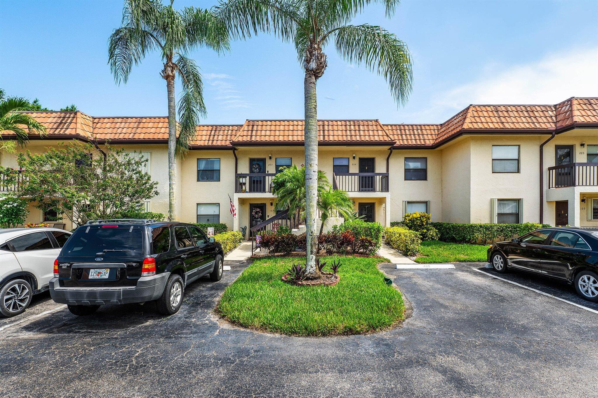 Situated on the second floor, this exceptional 55 plus condo boasts two bedrooms and two bathrooms, showcasing a perfect balance of comfort and refinement . As you enter, you will notice the spacious living area, perfect for unwinding and entertaining. Dedicated parking is mere steps from your doorstep. The residence features newer appliances, a/c, hot water heater, wood-like tile floor and carpet. The split floor plan offers a primary bedroom with private bath. The screened balcony affords picturesque water views. Washer and dryer is located in utility closet on balcony. The community's private clubhouse features a pool, spa and is within walking distance. Lucerne Lakes is conveniently located close to shopping centers, turnpike, airport, hospitals and dining.