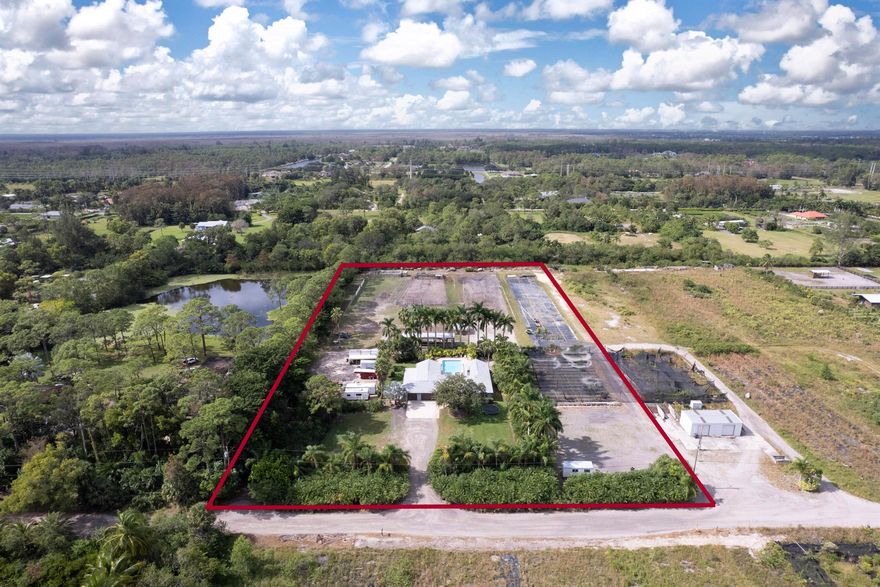 Welcome to Park Lane! The opportunities are endless on this 5.02 acre Nursery / Equestrian Farm. This property offers a newer roof 2023- plenty of parking for work and pleasure vehicles. Ample room to make an equestrian dream facility OR the perfect place for your Agriculture business. Residence offers 3 bedrooms, 2.5 baths with BONUS office AND enclosed Florida room for an option to make a 4th bedroom. Courtyard style layout allows you see the gorgeous oversized pool lined with lush mature palms from living areas. Tons of entertaining space! On one side of the property you have a full functioning nursery business, and behind the main residence you have a large pasture with 4 stalls shed row style. This property is zoned Agricultural and ready for you to make it exactly how you want it!