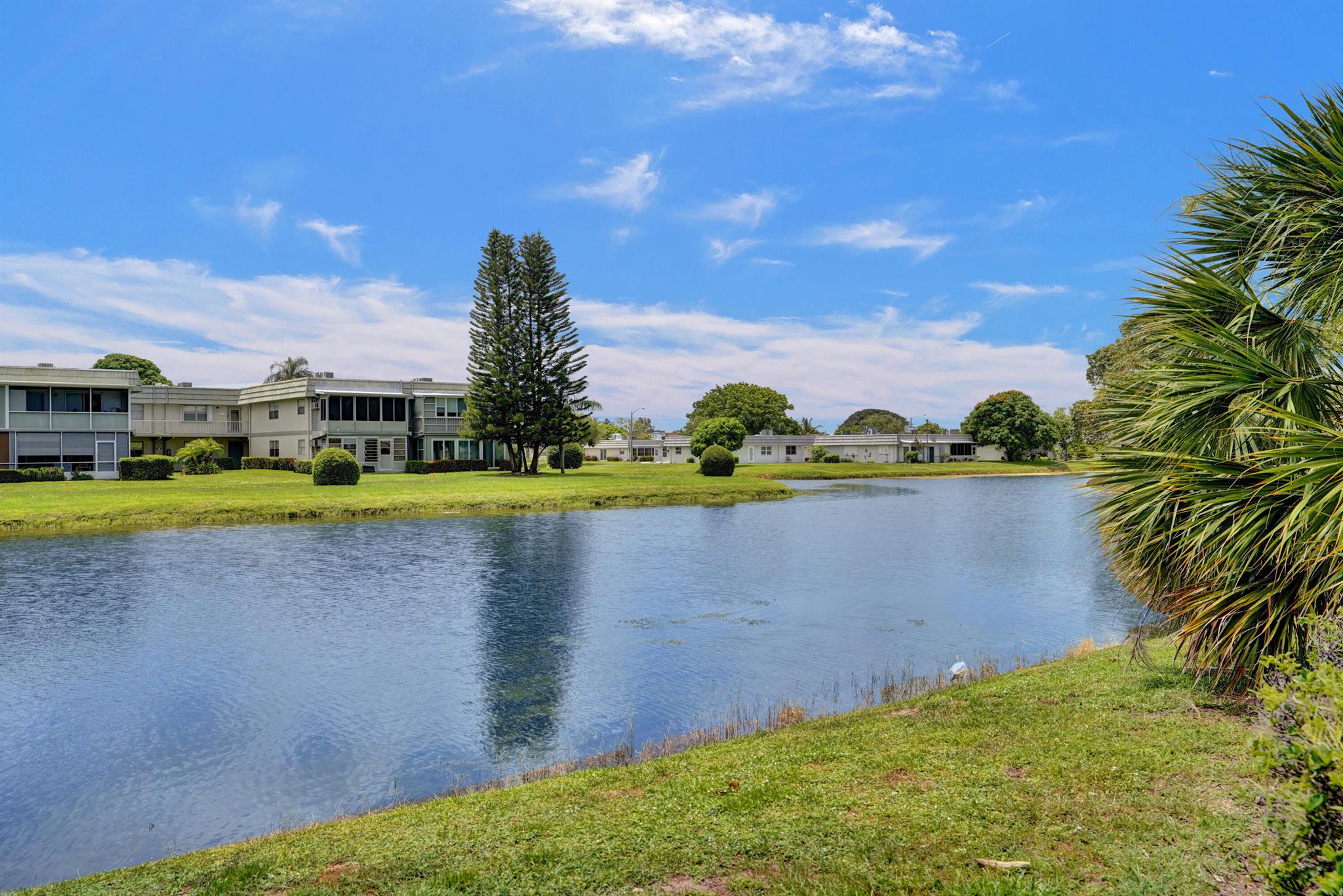 BEAUTIFULLY MAINTAINED WITH GORGEOUS WIDE CANAL VIEWS!!! FURNISHED - ANNUAL OR SEASONAL (4 MOS MINIMUM) RENTAL IN THE VERY ACTIVE KINGS POINT ADULT ACTIVE COMMUNITY. Just bring your clothes and toothbrush and enjoy this duplex style 2 bedroom/2 bath immaculate villa. Nice wood cabinet fully equipped kitchen. The Great Room is very pleasant and there is an eat-in dining area. Both baths have been partially updated and the master bedroom windows are impact. Newer washer and dryer. Tasteful furniture. VERY quiet and private location within the community. COME SEE!!!