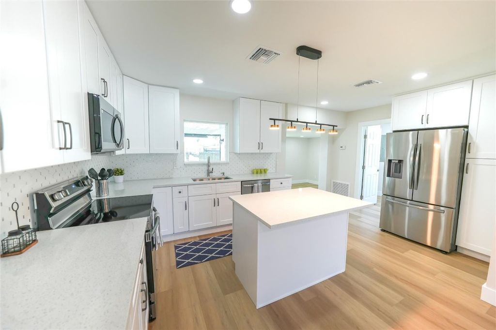 Photo of 124 E Arbor Avenue, Port Saint Lucie, FL 34952 (MLS # F10457761)