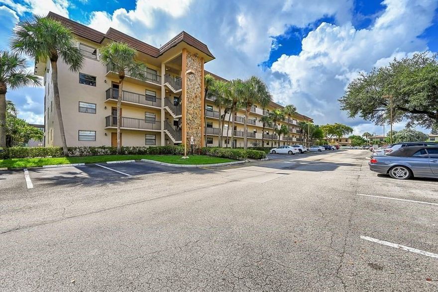 MOTIVATED SELLER !!   Beautiful  condo in this 55+ community located in the heart of Tamarac! This centrally located gem is just minutes away from everything you need, from the beach to the shopping center and airports. Step inside, fall in love and enjoy the modern contemporary design.  The spacious living and dining rooms, and a fully functional kitchen. Sip your morning coffee and enjoy the gorgeous garden view from your screened balcony in a private corner of this fully spacious 2/2 unit. With over 1,200 sq ft of living space, Spacious walk-in closet in the Master, and a stackable washer/dryer. plenty of storage.   The convenience of an assigned parking spot. Amenities include 2 heater pools, tennis courts, a shuffleboard, billiards and a clubhouse.   ASSESSMENTS HAVE BEEN PAID.  The unit is vacant and ready for immediate occupancy.  Whether you're looking for a primary residence, seasonal retreat, or investment opportunity