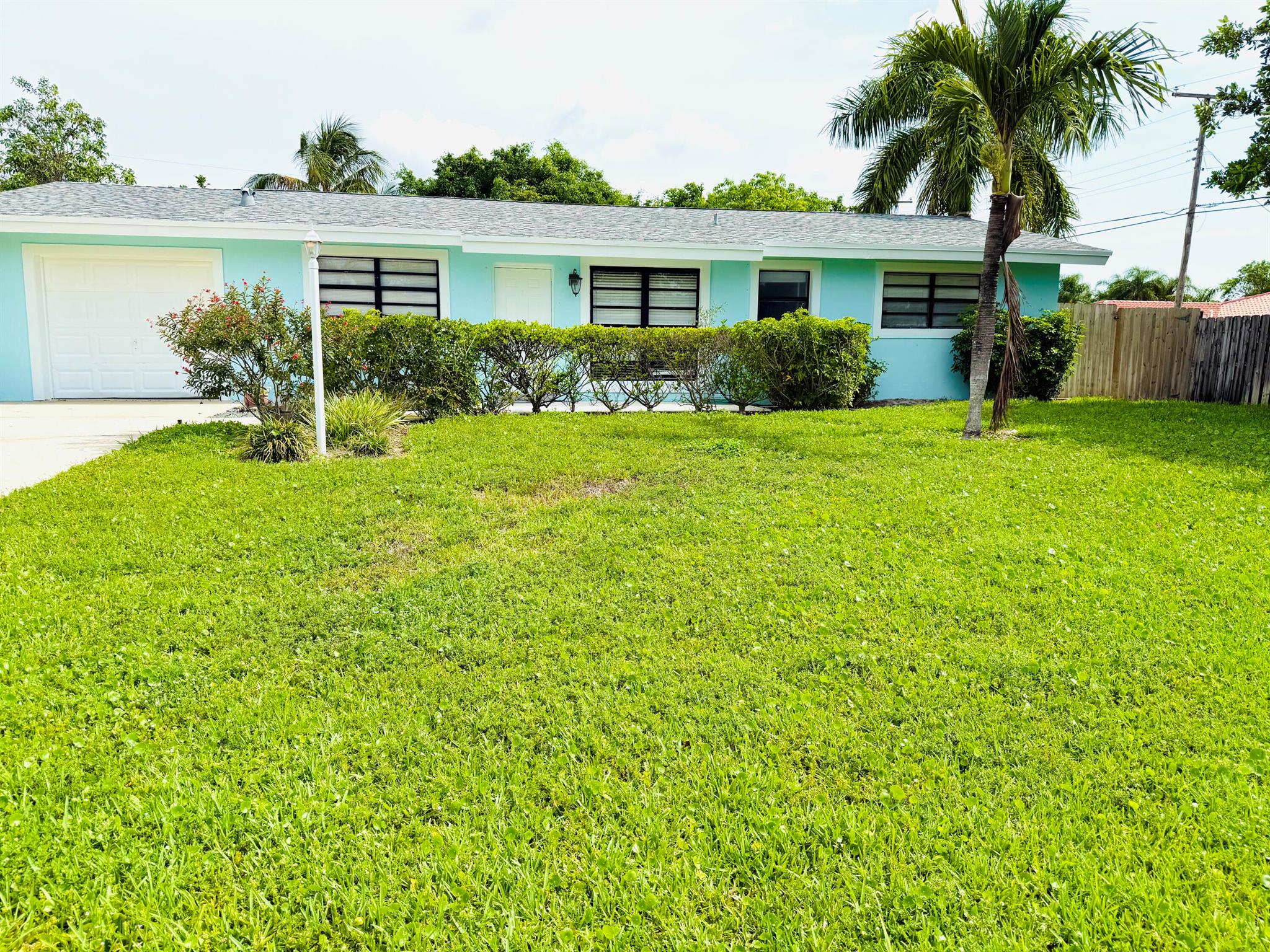 East Boca Raton Gem! No HOA & Minutes to the Beach! This 3 Bedroom 2 Bath home features beautifully upgraded bathrooms and a stylish kitchen with granite counters, stainless steel appliances, pendant lighting, and large neutral diamond set tile flooring throughout. Spacious bedrooms, and a primary ensuite with walk-in shower and walk-in closet. Guest bath includes a shower/tub combo. Enjoy a fenced backyard with a patio, which is perfect for entertaining. Pet-friendly and attached garage completes this home. Live the Florida lifestyle with no HOA and easy access to shopping, dining, and just minutes to the beach!