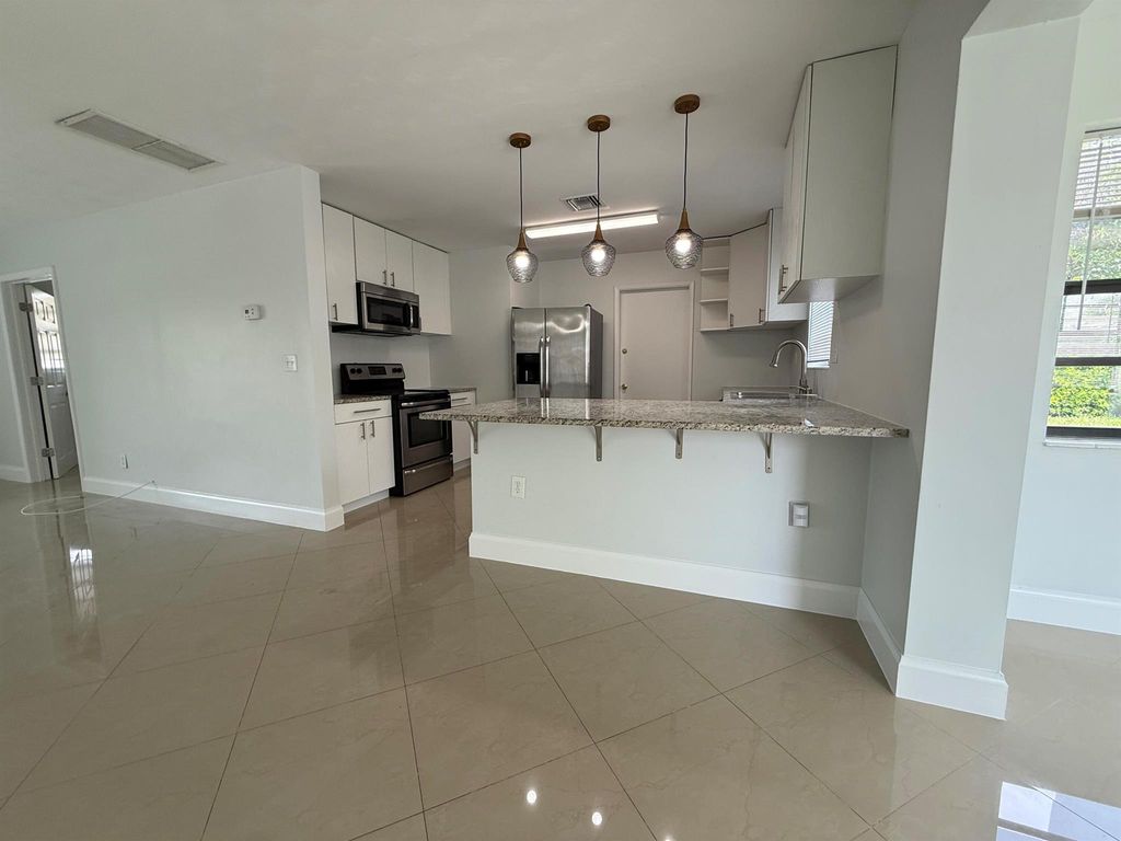 Photo of 477 NE 35th Street, Boca Raton, FL 33431 (MLS # R11090169)
