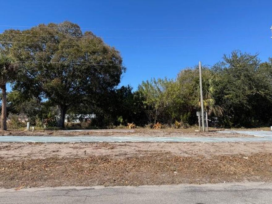 55 + CO-OP Community, Whispering Creek. Vacant Lot...Ready for Your Mobile Home or Tiny Home! That's right...TINY HOME APPROVED! This cleared and ready-to-go oversized, canal backed lot is nestled on the far West side of this welcoming CO-OP community, where you OWN a share in the park. This is not a land lease! Unbelievably low HOA...only $255 a month! The lot comes with power and water hookups, so bring your vision and settle into affordable Florida living with ease. Whether you're dreaming of a cozy mobile home or a trendy tiny home escape, this is your blank canvas in a peaceful, community-oriented setting.