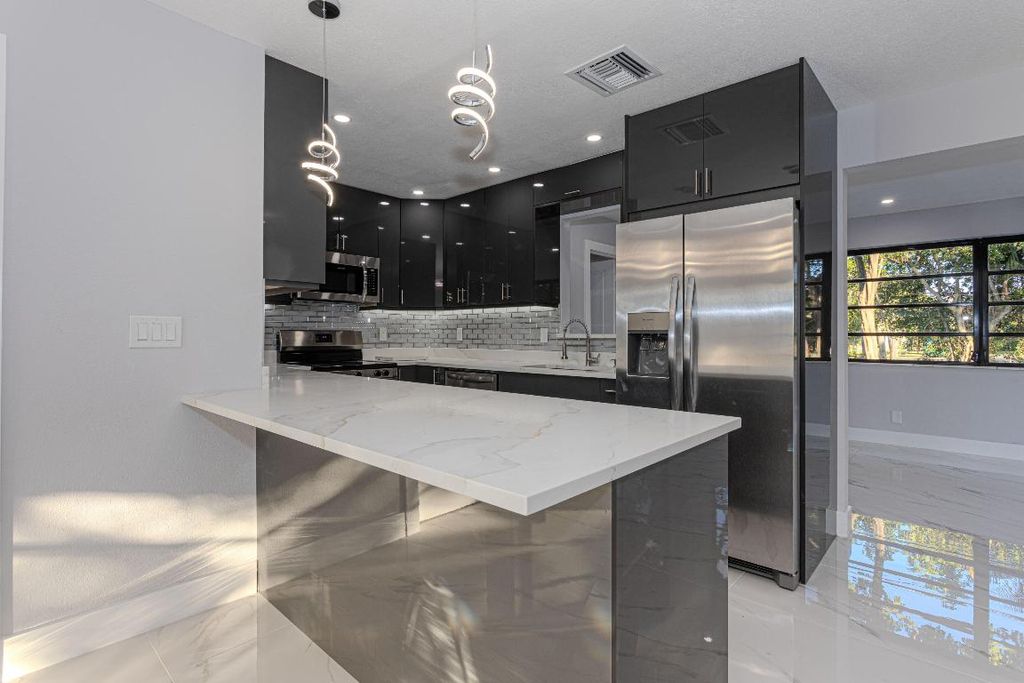 Photo of 62 Andros Road, Palm Springs, FL 33461 (MLS # R11144042)