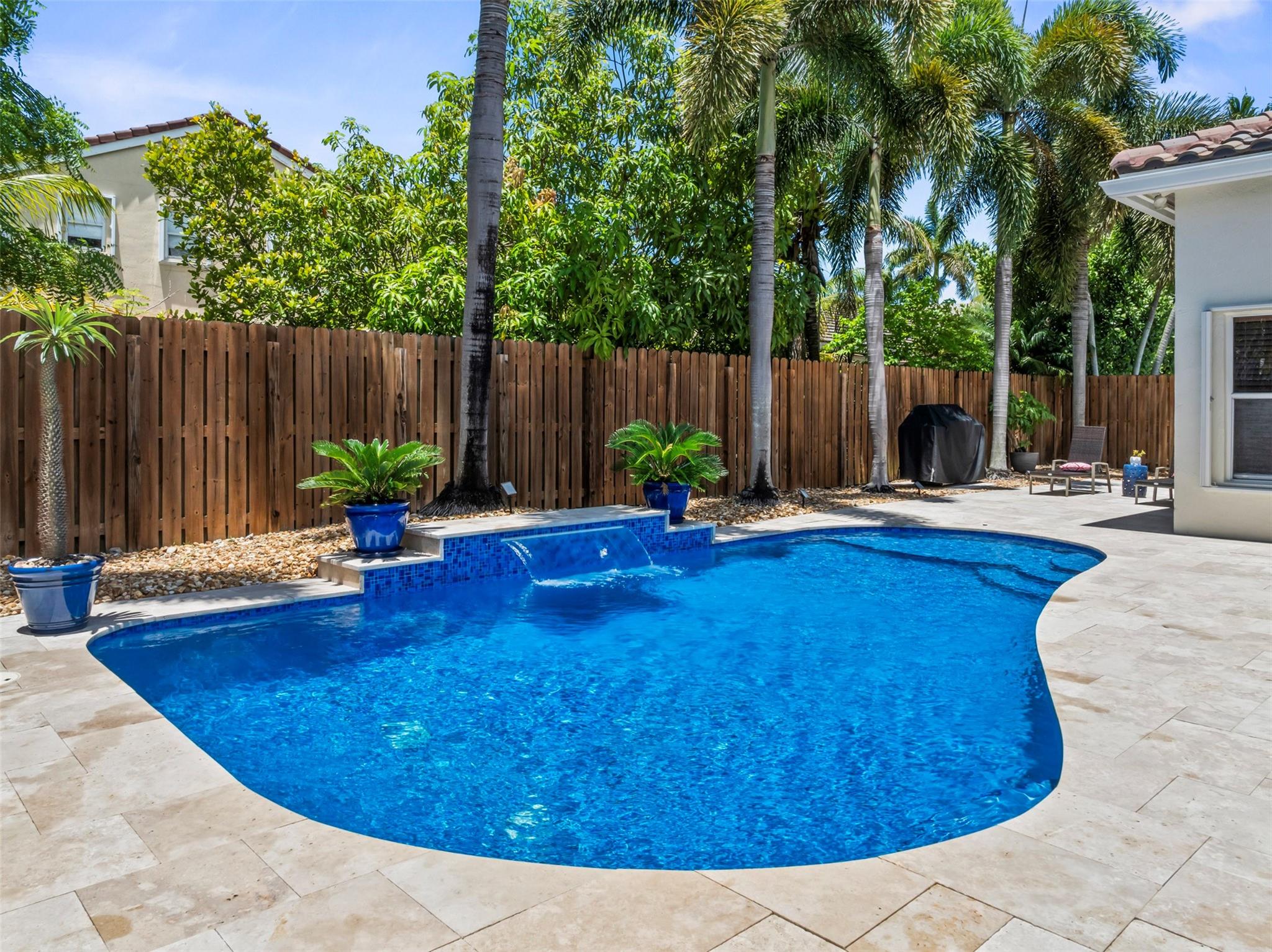 Spacious and beautifully upgraded *4-bedroom, 2.5-bath* home with *2,392 sq ft of living space*, situated on a *7,172 sq ft lot* in a highly desirable *gated community with low HOA fees* and zoned for *A+ rated schools*. This move-in ready home features a *fully REMODELED kitchen* with *stainless steel appliances*. Enjoy comfortable living with *laminate flooring in all bedrooms*, *REMODELED primary and secondary bathrooms*, and generous living areas throughout. Step outside to your private backyard oasis, complete with a *pool and travertine patio (2019)*—perfect for entertaining. Additional upgrades include a *new roof (2021)*, *accordion shutters*, and *impact-rated front and garage doors* A rare opportunity to own a home that checks every box—space, style, upgrades, and location!