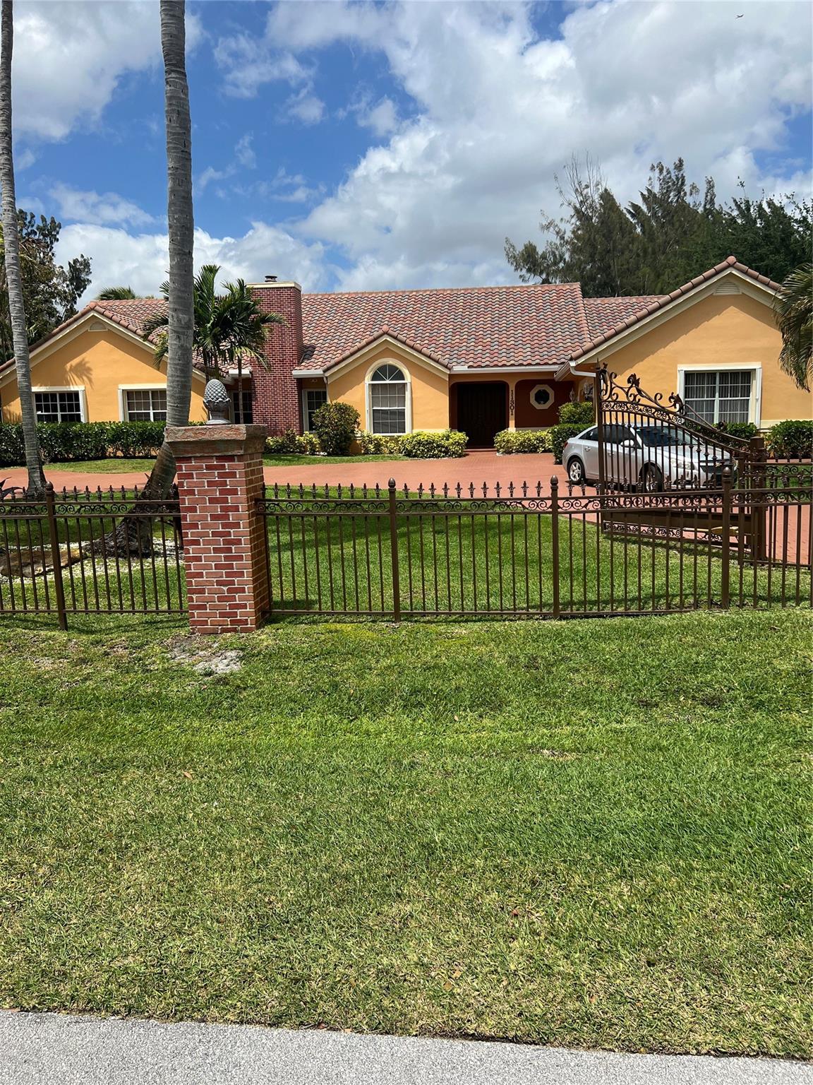 BEAUTIFUL 5 BEDROOM 3.5 BATH WITH 2 CAR GARAGE AND OVERSIZED POOL AND SPA* FENCED IN ACRE* FIREPLACE* OPEN FLOOR PLAN WITH LOFT AND EXTRA BONUS ROOM OFF THE MASTER FOR OFFICE OR NURSERY*SPLIT BEDROOM PLAN* MARBLE FLOORS*HUGE OUTDOOR PATIO WITH SUMMER KITCHEN*SAUNA*BEST LOCATION IN PLANTATION ACRES*NEAR AMERICAN HERITAGE* LOVELY!!!