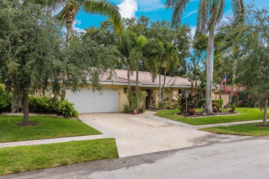 Immaculate 3 bedroom, 2 bath 1933 Sq.Ft. home with lush tropical pool area and screened patio enclosure in Boca Raton Square.  Wood floors throughout. Totally updated with Impact windows, Impact garage door with back up battery power, solid wood interior doors, new and updated electrical panel, new A/C July 2015. Boat or trailer parking area.  Best school district and wonderful family community.