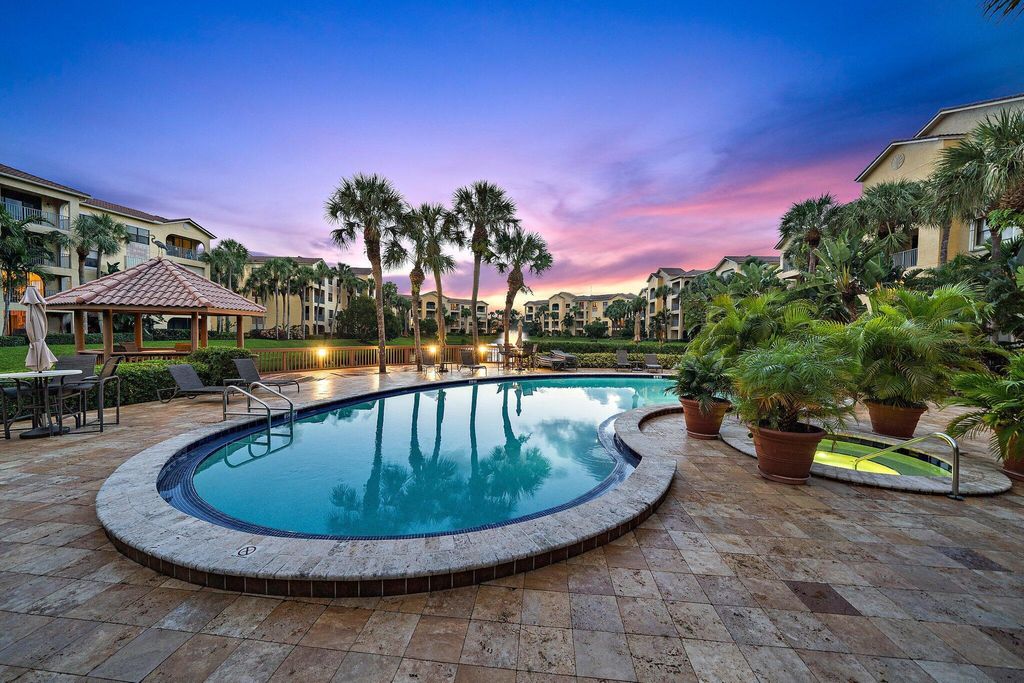 Photo of 800 Uno Lago Drive #104, Juno Beach, FL 33408 (MLS # B26026358)