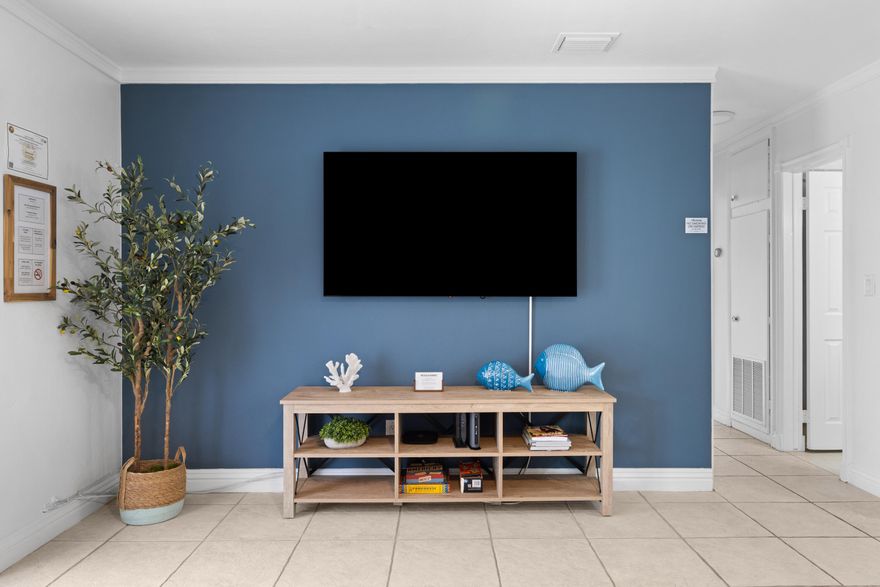 Fully furnished 3-bedroom, 2-bath home just one block from Wilton Drive. Currently operating as a successful Airbnb, making it a great option for a primary residence, second home, or income-producing property. The third bedroom features its own private entrance and en-suite bath, ideal for guests, in-laws, or rental flexibility.  The home offers an updated kitchen with stainless steel appliances, open living spaces, and a new roof installed in June 2024. Additional features include impact windows and doors, plus a fully fenced backyard for added privacy.  Well maintained and move-in ready.