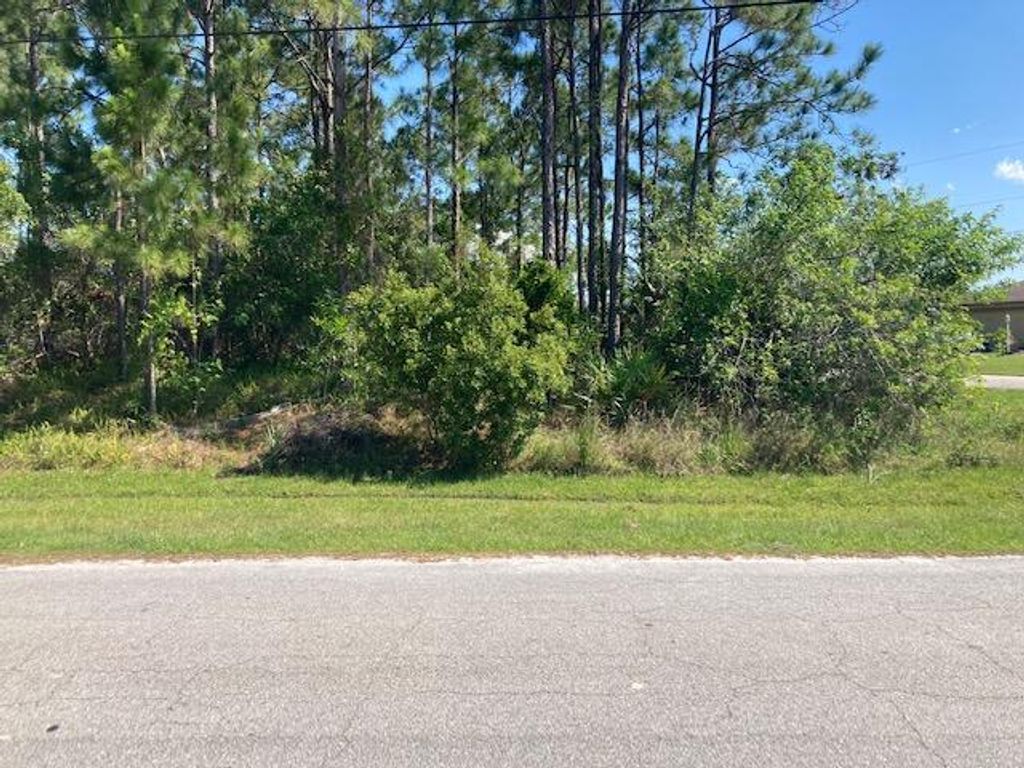 Photo of 5845 NW Whitecap Road, Port Saint Lucie, FL 34986 (MLS # R10797345)