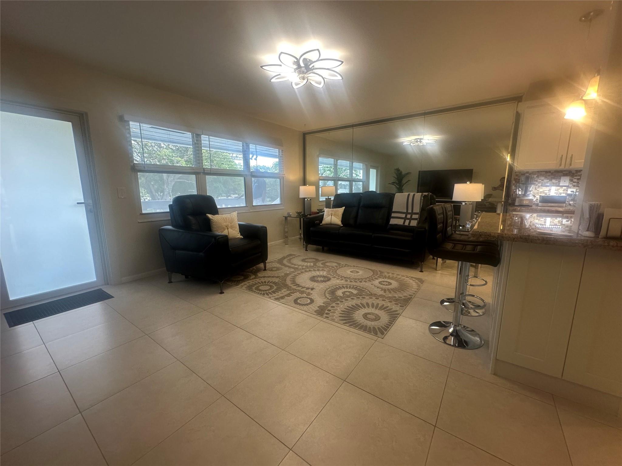 Great location! Bright & airy, second floor garden apartment. 1 bedroom, 1.5 bath condo in active adult community in the heart of Deerfield Beach! Across from heated outdoor pool. Hurricane impact front door and windows! Fully furnished with NEW FURNITURE! OPEN KITCHEN! New electrical panel, two new fans, renovated guest bathroom. New A/C unit in living room. Lovely garden view on patio with extra storage & roll down hurricane shutters. Extra freezer. CVE offers amenities galore including a lavish clubhouse, 1,500 seat theater, premier performances, shuttle buses, state of the art gym, pickleball & tennis, indoor & outdoor pools, movies, classes of every type and more! Close to shopping, restaurants & beach. Rentable after two years of ownership. Assoc claims 55+.