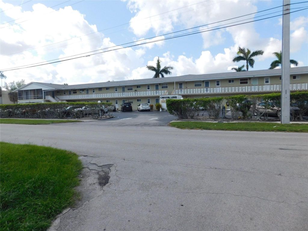 Photo of 960 Crystal Lake Drive #201, Deerfield Beach, FL 33064 (MLS # B26020759)