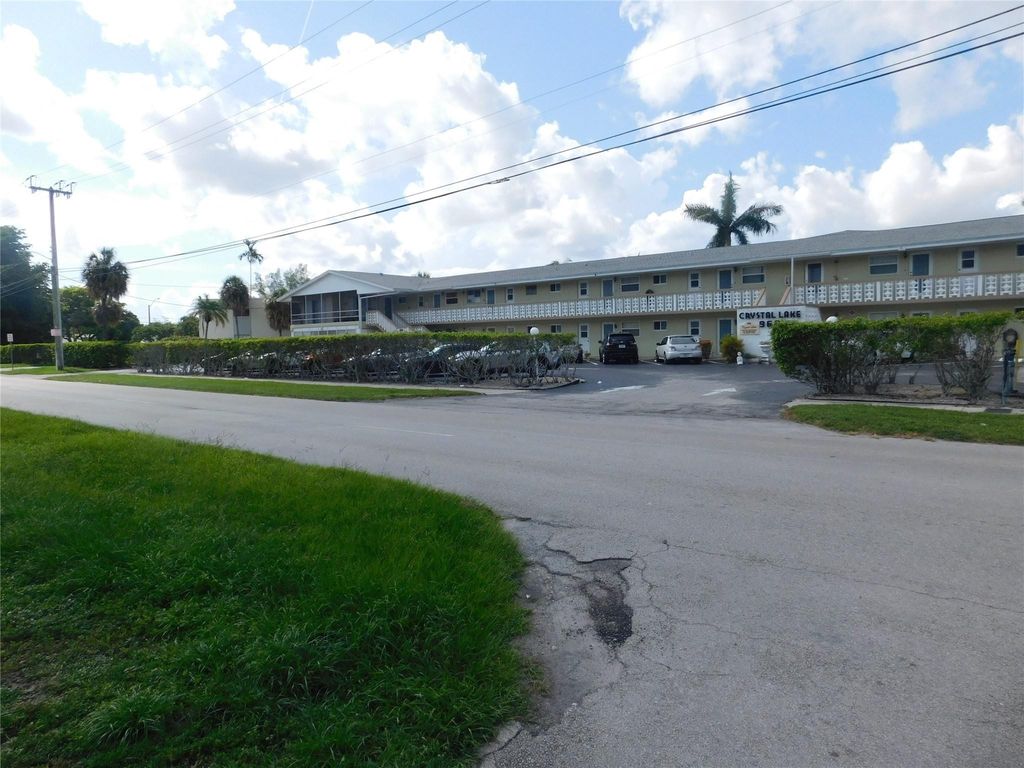 Photo of 960 Crystal Lake Drive #201, Deerfield Beach, FL 33064 (MLS # B26020759)