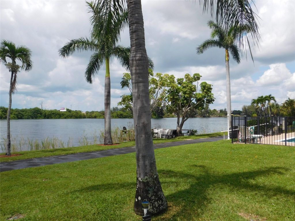 Photo of 960 Crystal Lake Drive #201, Deerfield Beach, FL 33064 (MLS # B26020759)