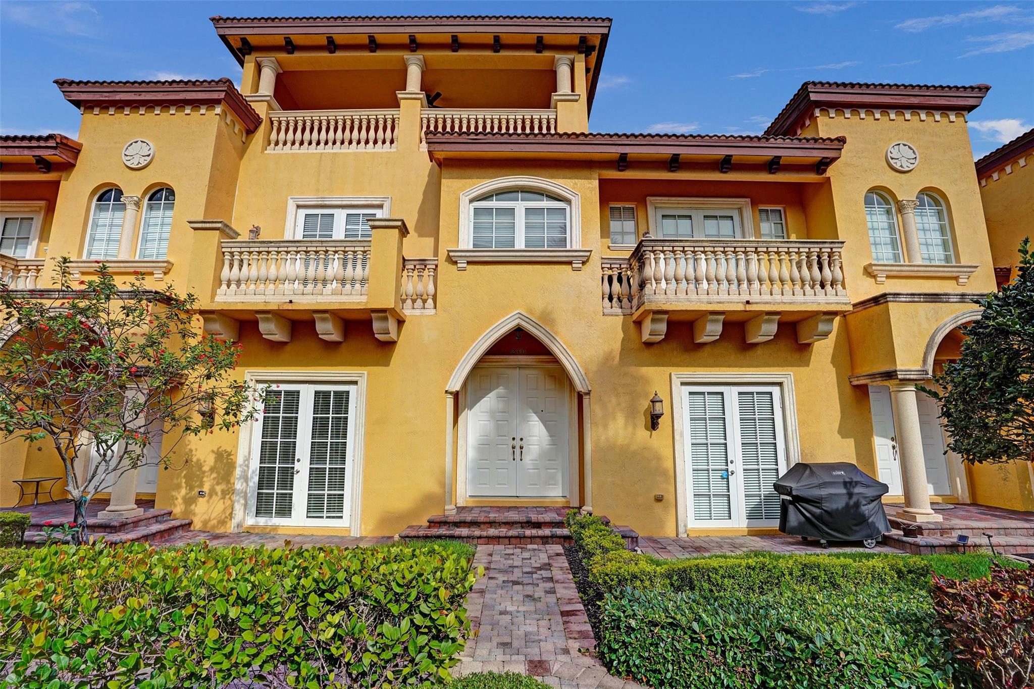 Welcome to 230 NE 69th Circle at Tuscany Village! Situated behind private security gates, in one of Boca Raton's most desired locations, this remarkable 3 Bed + 3 Full Baths + Private Elevator Tri Level Townhome has been impeccably updated + maintained and is the epitome of move in ready! Interior features include marble + wood flooring + high ceilings throughout. Spectacular updated kitchen with all new cabinetry + counters throughout! The private + oversized primary suite includes an additional lounge / work space + a spectacular oversized balcony terrace which overlook the picturesque community courtyard + pool areas. The second level walk-in laundry area features a full size wash sink. Oversized two car garage + impact windows + doors throughout. Last! Let's Take A Look...
