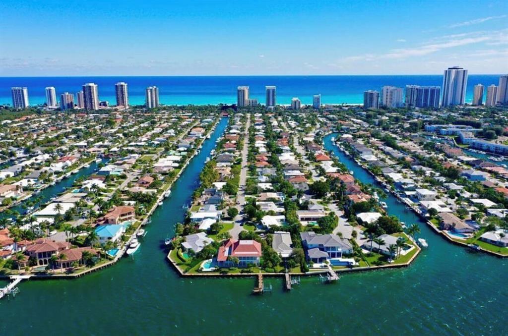 This extra-large lot (15,150 sqft) has deep water dockage and 75' of waterfrontage. The property offers southern exposure and is minutes from the Lake Worth Inlet and Peanut Island, with no fixed bridges to get to the ocean. The dock can accommodate up to 55' boat or multiple boat lifts. Only a short walk to the beautiful Singer Island beaches. This price reflects lot value only. See video walk through. Existing gutted shell and functional boat lift on property.Available separately: A sealed set of plans for a two-story 4,950 sqft custom home with 1,970 sqft garage and pool. MORE ->>>>>>
