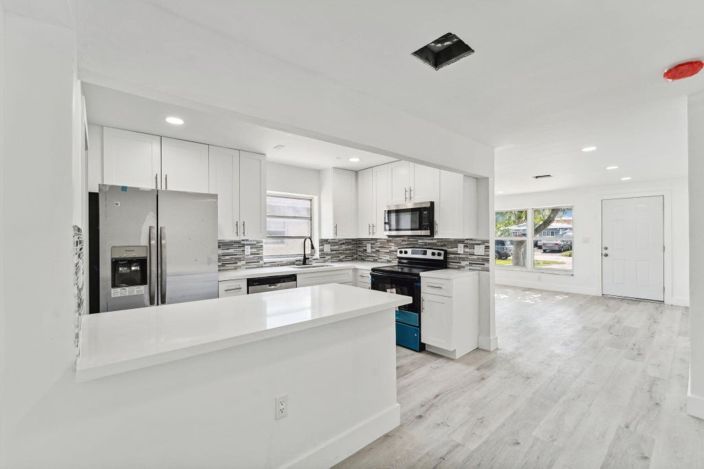 Photo of 573 NW 2 Way, Deerfield Beach, FL 33441 (MLS # R11002281)