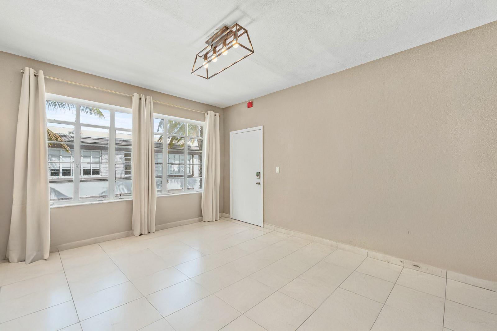 Live steps from the sand in this beautifully furnished and stylishly updated studio apartment, ideally located in the vibrant North Beach neighborhood of Miami Beach. Just one block from the ocean and minutes from world-renowned Bal Harbour Shops, this ground-floor unit sits in a quiet, gated, and secure complex offering peace, privacy, and convenience. The bright, airy space is designed for comfort, with tasteful furnishings and a layout that makes the most of the natural light. Outside your door, enjoy the best of coastal living—morning walks along the beach, bike rides on the scenic Ocean Terrace path, and evenings dining at local gems that blend Latin, Mediterranean, and classic Miami flavors.